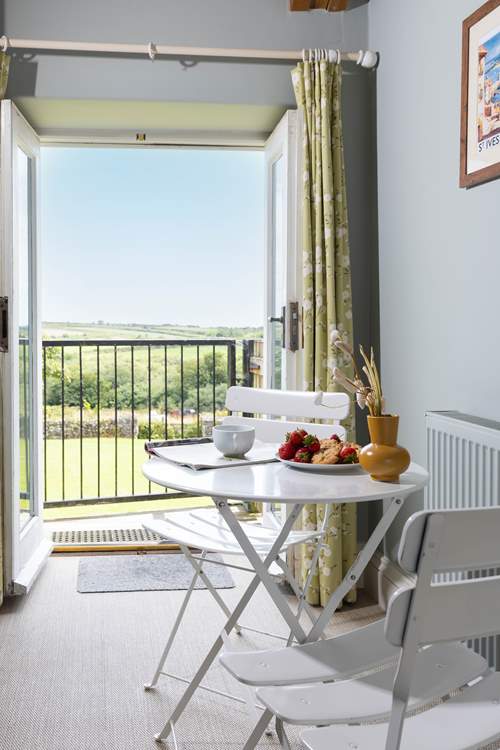 There is a cosy breakfast table for two.