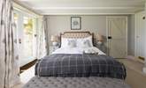 The principle bedroom has a luxurious super king bed and ensuite bathroom. - Thumbnail Image