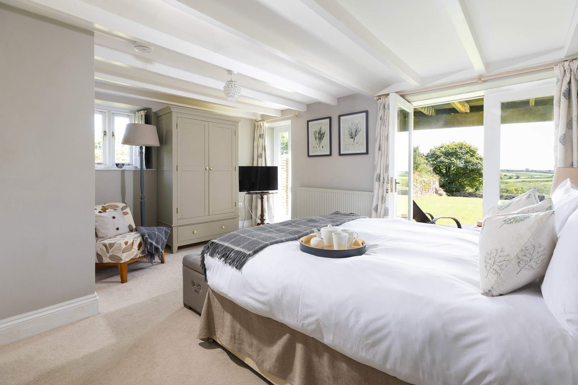 The principle bedroom has double doors that open to the large garden. 