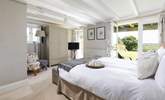 The principle bedroom has double doors that open to the large garden.  - Thumbnail Image