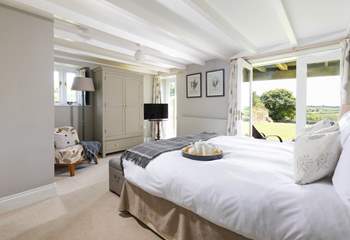 The principle bedroom has double doors that open to the large garden. 