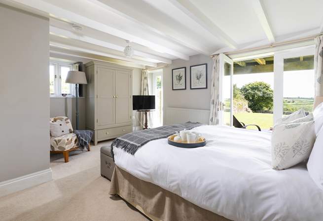 The principle bedroom has double doors that open to the large garden. 