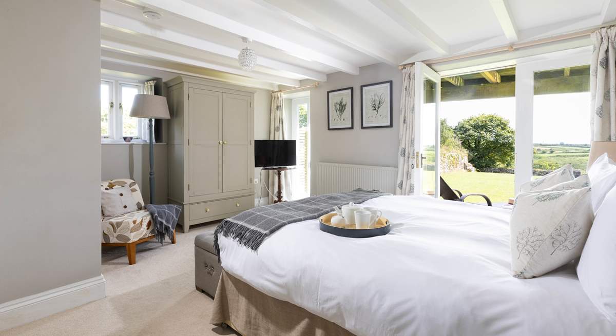 The principle bedroom has double doors that open to the large garden. 