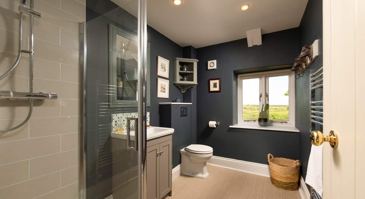 The stylish shower-room is located between the living room and kitchen on the upper floor.