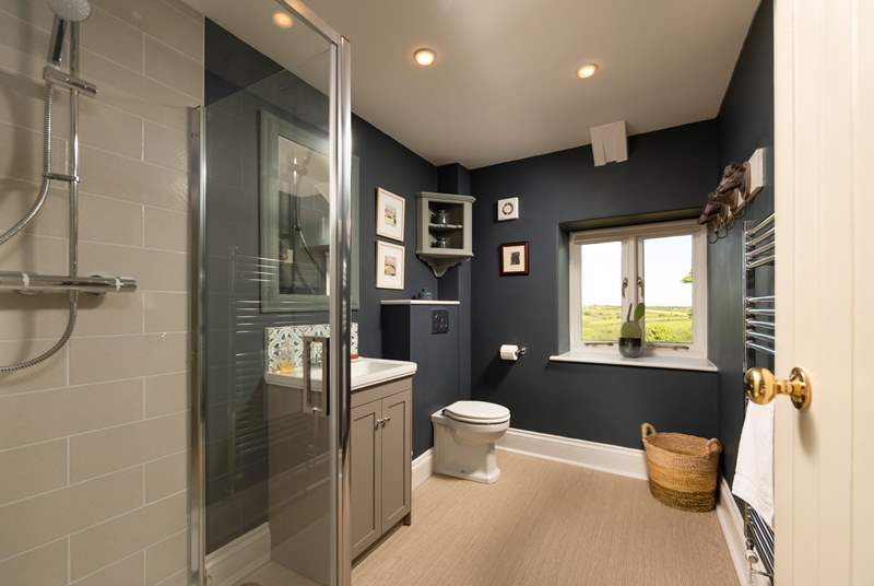 The stylish shower-room is located between the living room and kitchen on the upper floor.