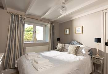The calm and relaxing second double bedroom looks out over the garden.