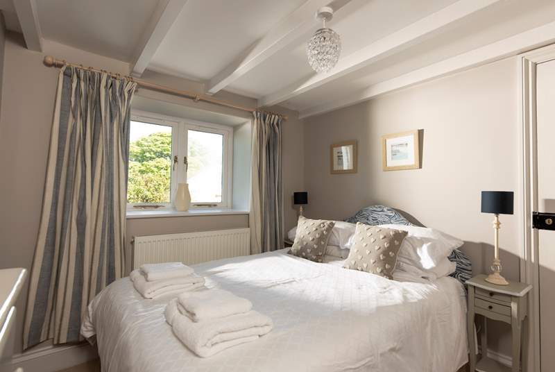 The calm and relaxing second double bedroom looks out over the garden.