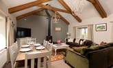 Room to relax and room to dine in this gorgeous living and dining space with a cosy wood-burner for those cooler days and nights. - Thumbnail Image