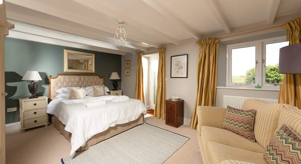 Your gorgeous and spacious main bedroom with en suite and a door directly onto the garden.