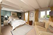Your gorgeous and spacious main bedroom with en suite and a door directly onto the garden.