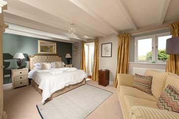Your gorgeous and spacious master bedroom with en suite and a door directly onto the garden.