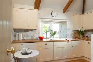 The well-equipped kitchen is on the first floor just along from the living-room so not far to go to get more ice for that G&T!