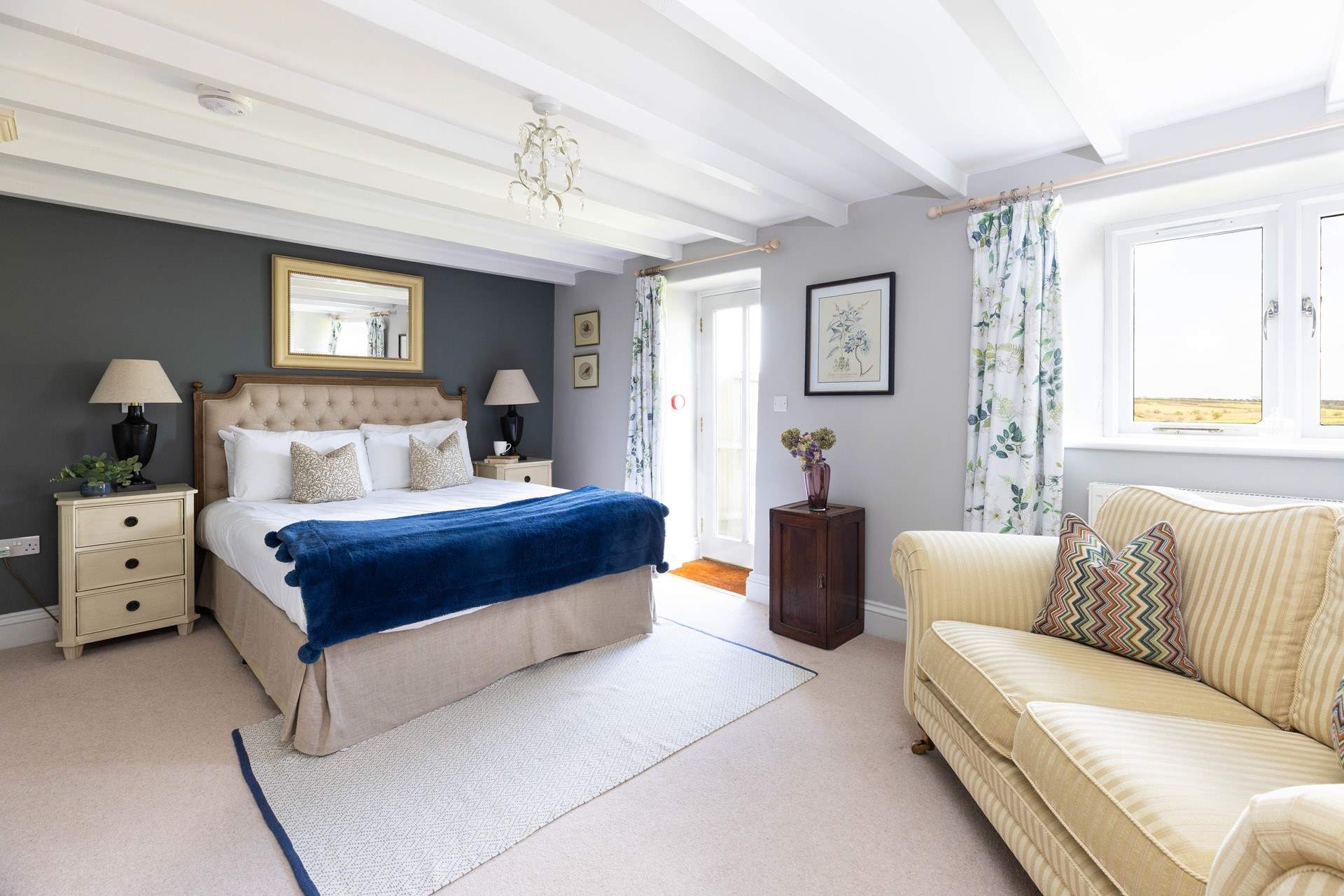 The principle bedroom has a king size bed and doors to the pretty garden (Bedroom 1). 