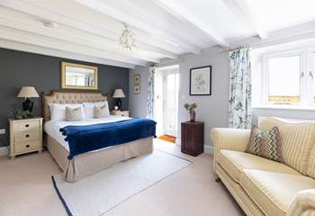 The principle bedroom has a king size bed and doors to the pretty garden (Bedroom 1). 