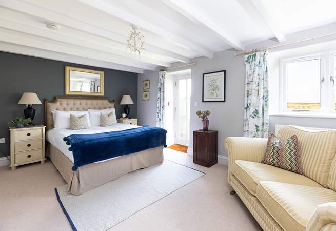The principle bedroom has a king size bed and doors to the pretty garden (Bedroom 1). 