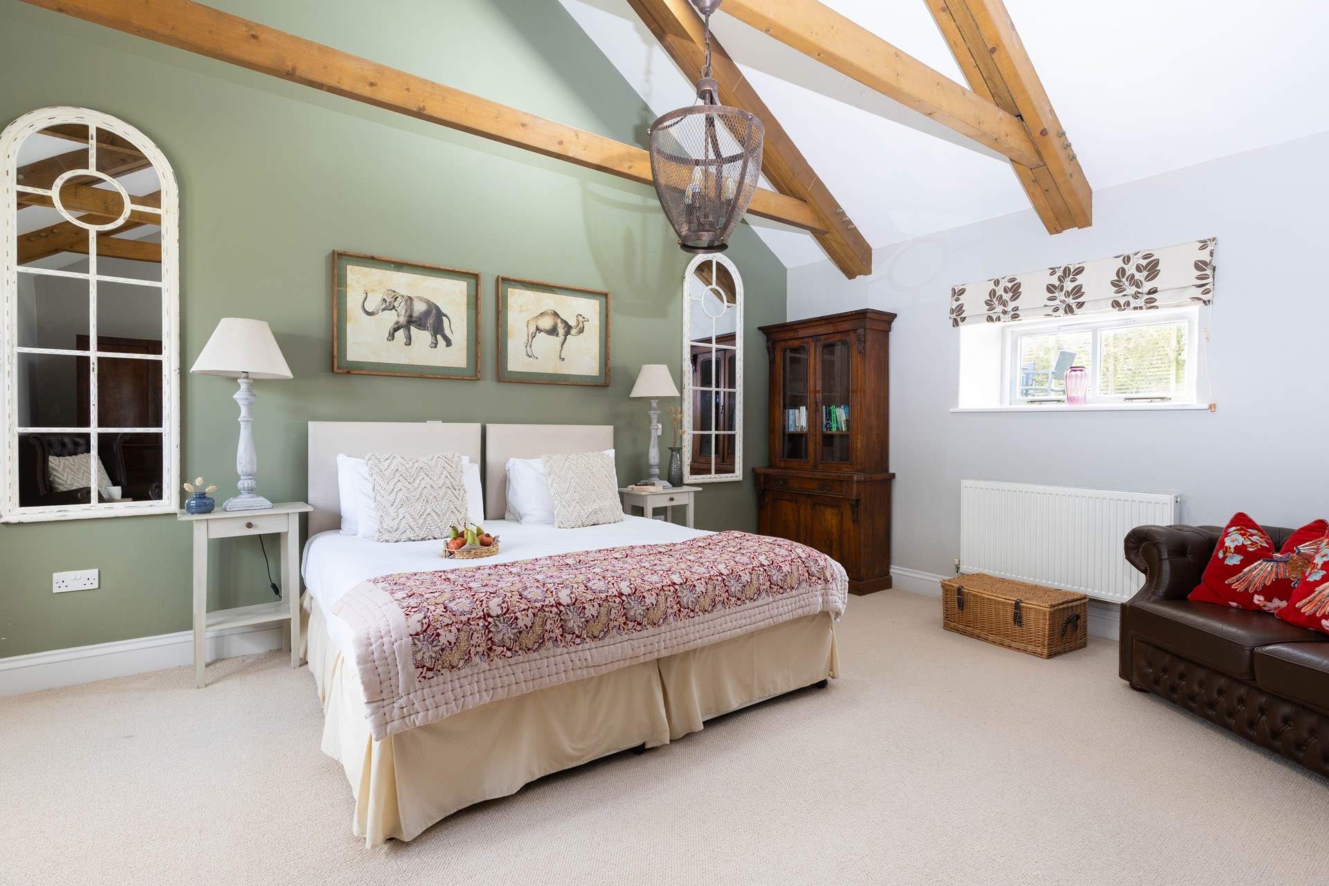 This bedroom has high vaulted ceilings to create a light and calming space. 
