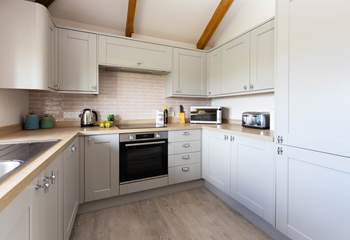 The modern kitchen has everything you might need. 