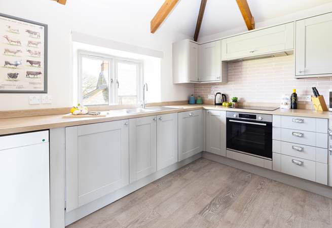 The well equipped kitchen has far reaching countryside views. 