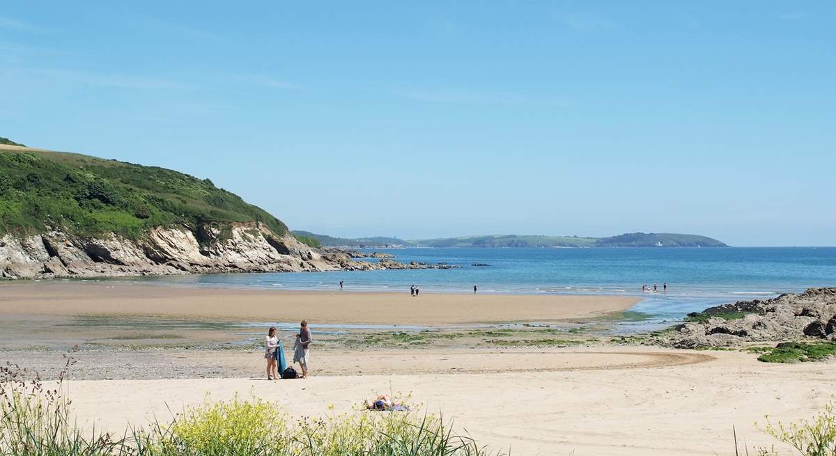 The beach at Maenporth cove as the tide recedes.