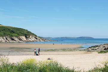 The beach at Maenporth cove as the tide recedes.