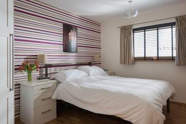 The master bedroom has a king-size bed.