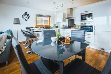 Enjoy catching up around the dining table with a rich glass of red wine.