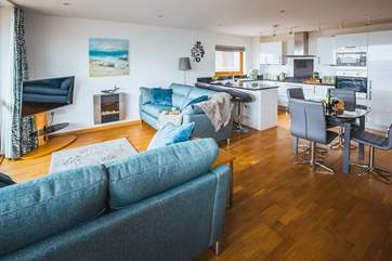 The open plan living space is open and bright, the perfect place to relax.