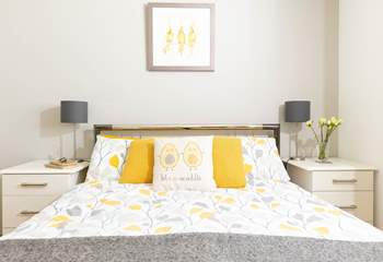 The main bedroom has a comfy king-size bed. 