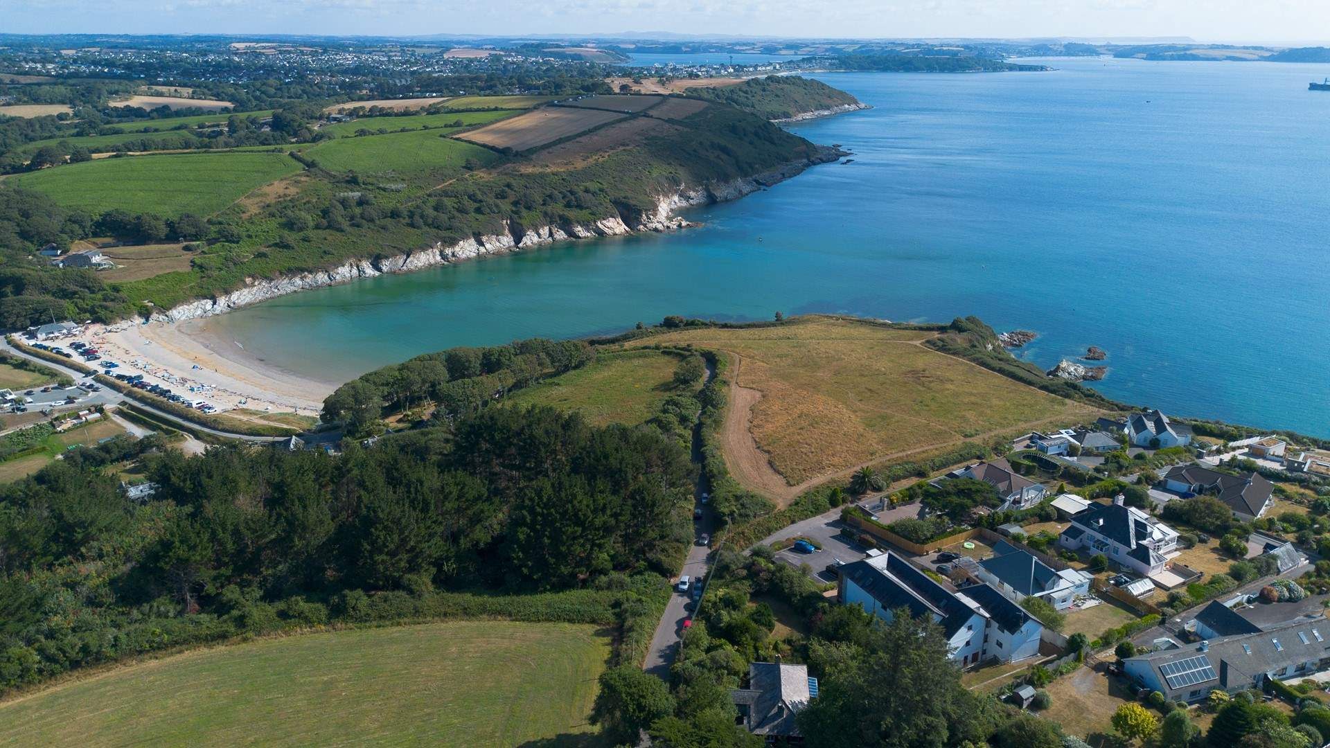 Bayview is in the long white building in the centre of the photo - as you can see just a short stroll down the hill to the beach. 