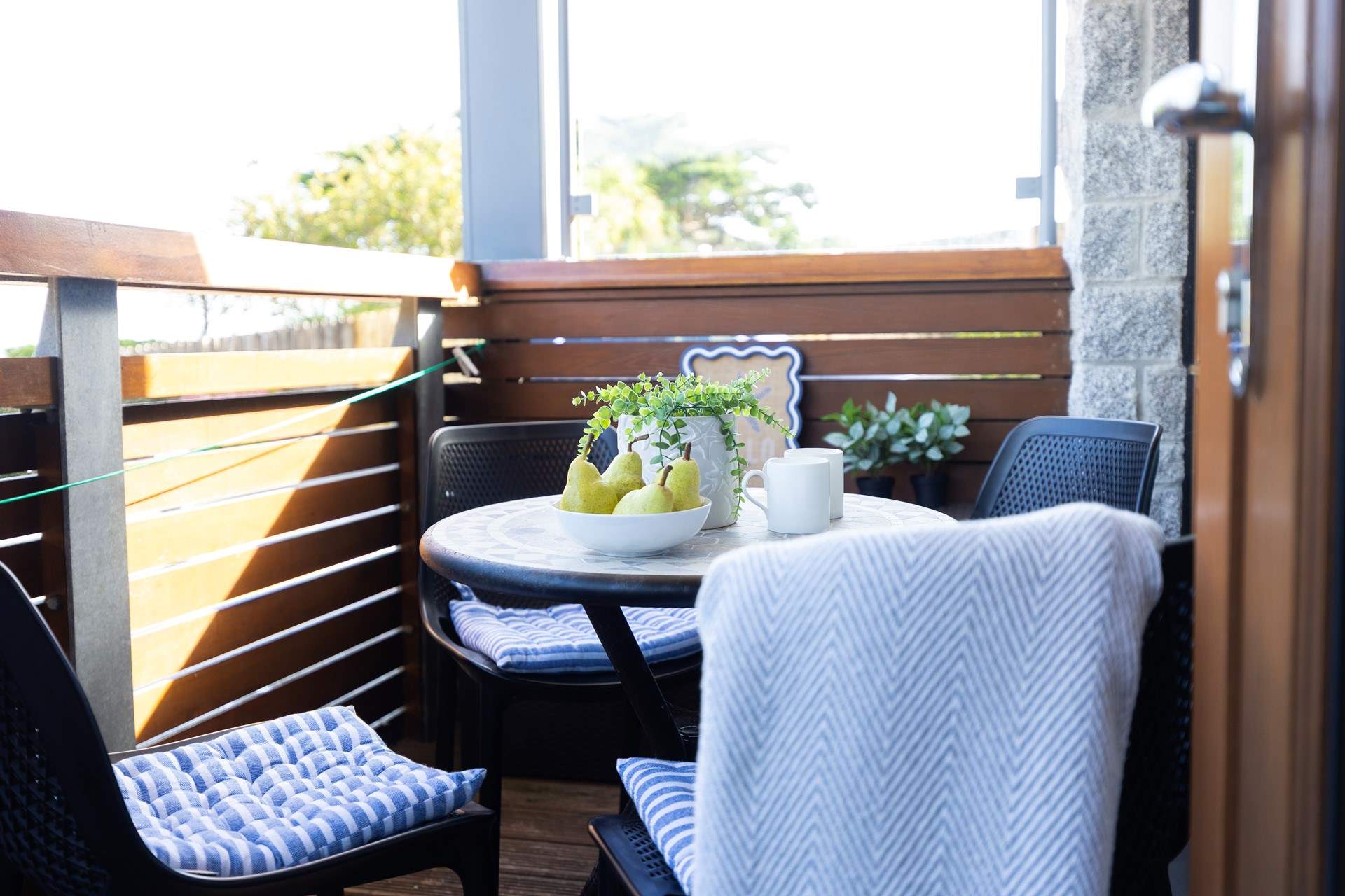 The balcony catches the sun and is a lovely spot to relax. 