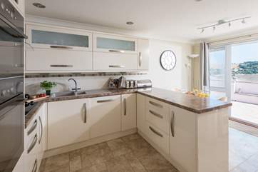 The well-equipped kitchen even has sea views.