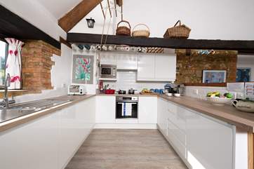 There is a wonderful new contemporary kitchen with a view out over the fields across the road.