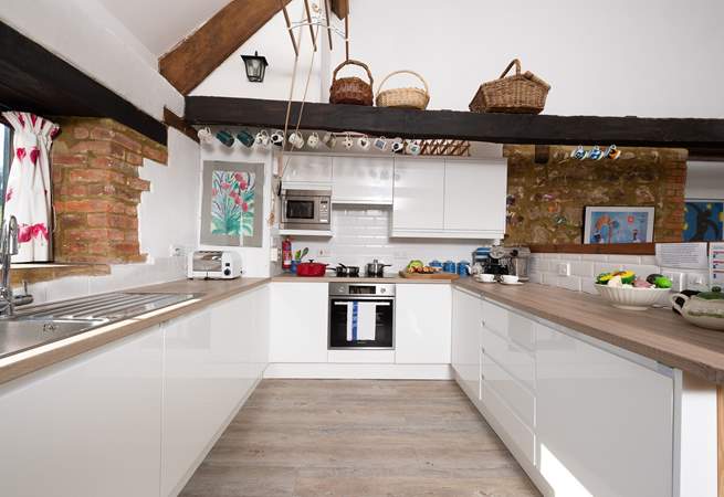 There is a wonderful new contemporary kitchen with a view out over the fields across the road.