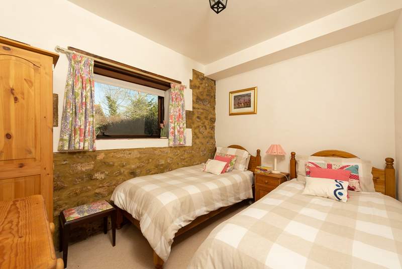 This is the twin bedroom which looks out over the courtyard towards the garden.