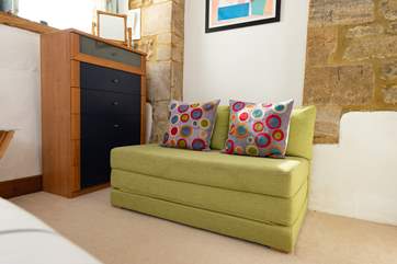 The bedroom sofa adds another feature as well as being useful.