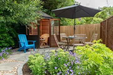 Hide away in the summer house with a good book.