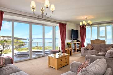 The large spacious sitting-room takes full advantage of the view.