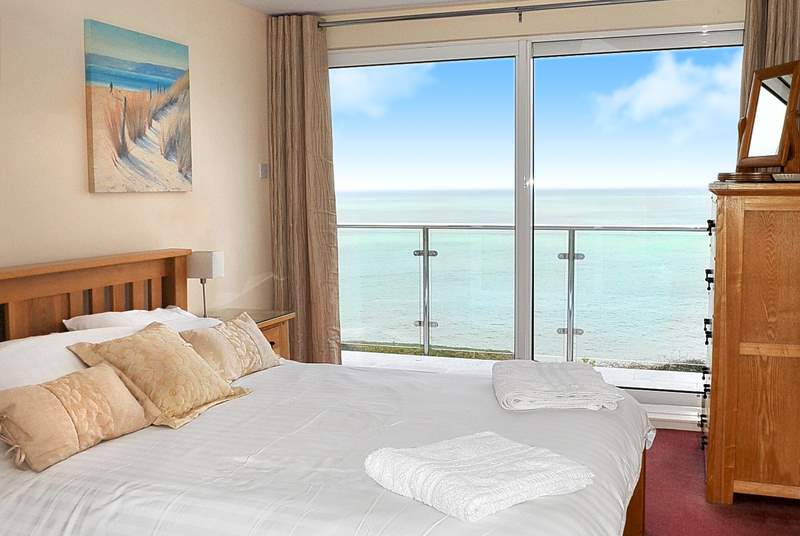 The double bedroom on the first floor takes full advantage of the stunning view, with sliding doors leading out to a small terrace - it's fabulous!