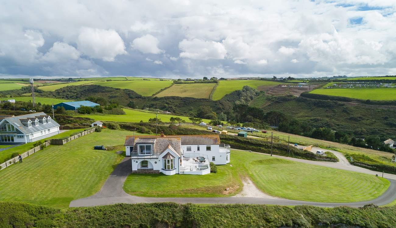 Silver Spray is surrounded by large lawned areas. The countryside behind the house is as stunning as the sea views.