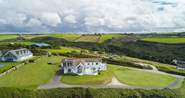 Silver Spray is surrounded by large lawned areas. The countryside behind the house is as stunning as the sea views.