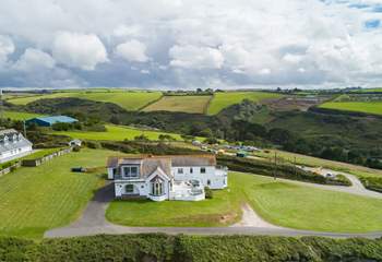 Silver Spray is surrounded by large lawned areas. The countryside behind the house is as stunning as the sea views.