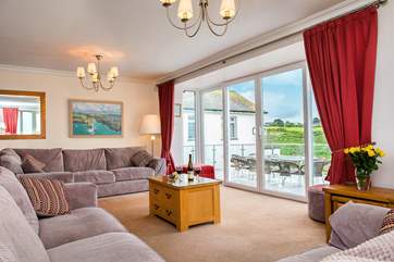 Patio doors lead out from the sitting-area to the large terrace.