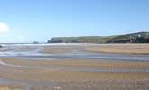 The beach at Polzeath is fabulous and popular with surfers and families alike. - Thumbnail Image