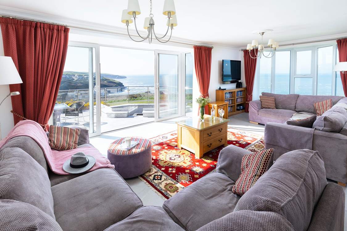 The large spacious sitting-room takes full advantage of the view.