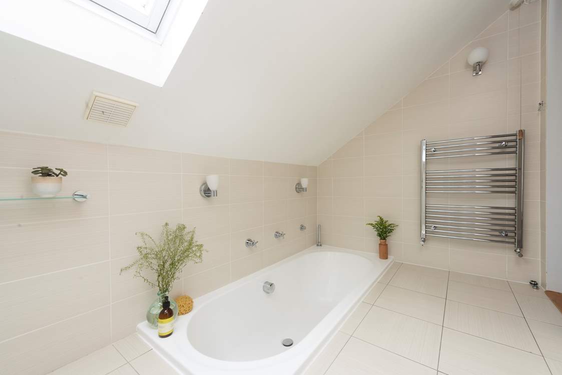 The upstairs bathroom has a sunken bath.