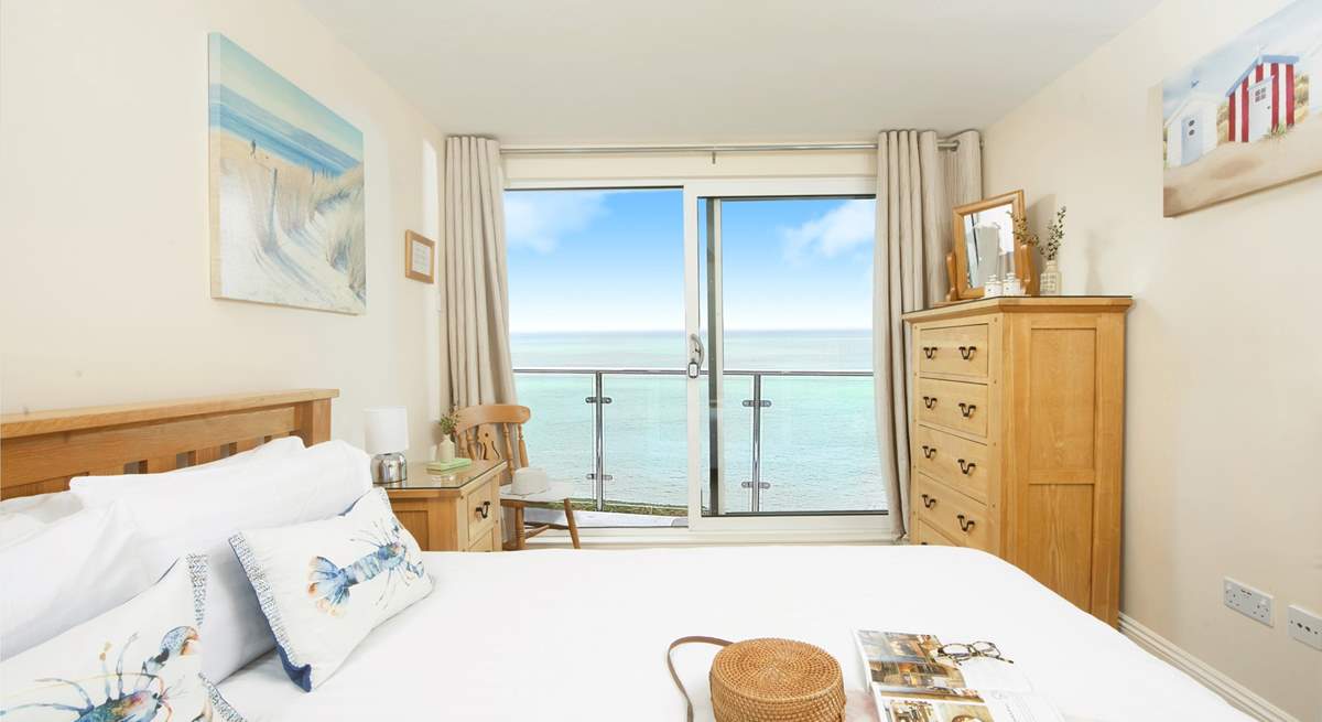 The double bedroom on the first floor takes full advantage of the stunning view, with sliding doors leading out to a small terrace - it's fabulous!