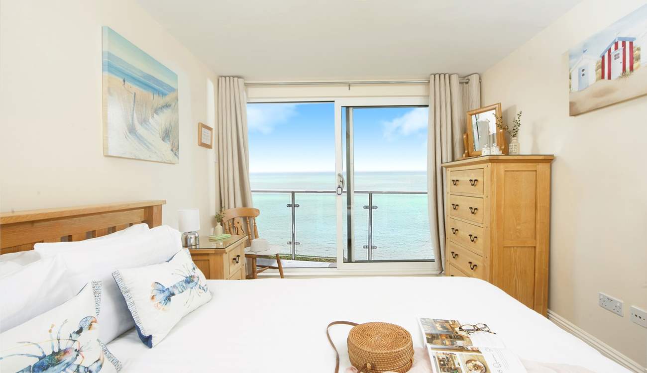 The double bedroom on the first floor takes full advantage of the stunning view, with sliding doors leading out to a small terrace - it's fabulous!