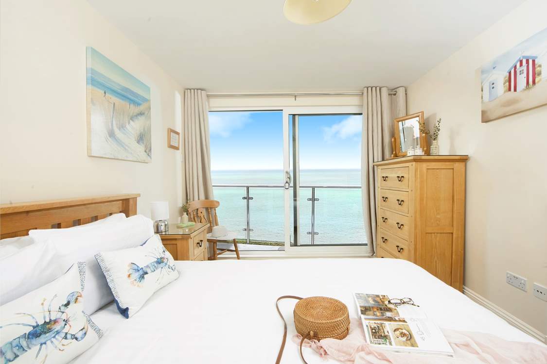 The double bedroom on the first floor takes full advantage of the stunning view, with sliding doors leading out to a small terrace - it's fabulous!