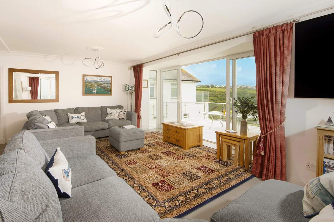 Patio doors lead out from the sitting-area to the large terrace.