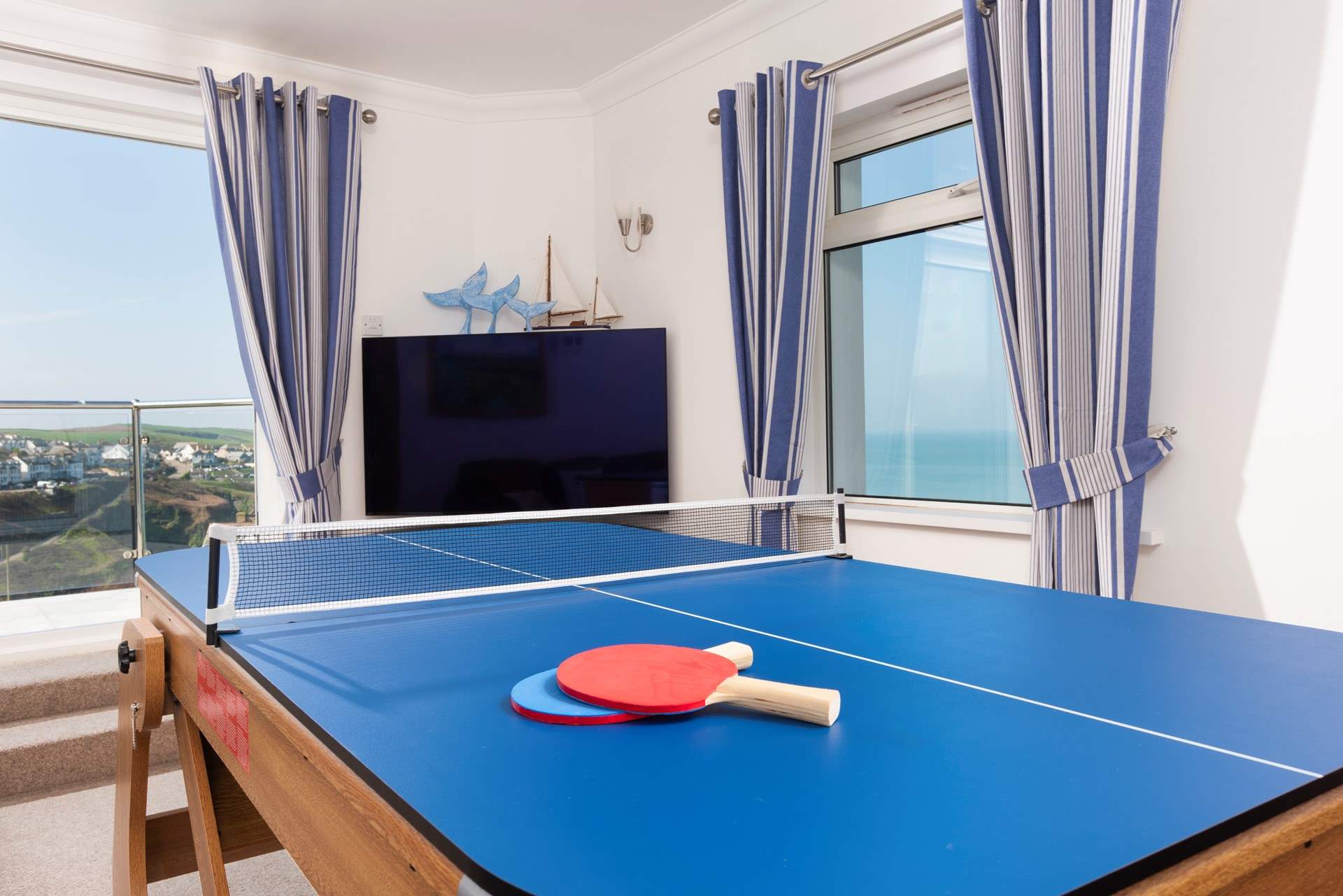 Or maybe Table Tennis is your game. Either way once you have finished playing, the games table can be stored upright so that you can enjoy the room as a Sung again. 